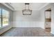 Bright dining room with chandelier and wainscoting at 5031 Mclaughlin Loop # 60, Waxhaw, NC 28173