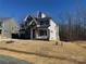 Two-story house on a lot with partial landscaping and other homes visible at 5031 Mclaughlin Loop # 60, Waxhaw, NC 28173