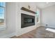 Modern fireplace with shiplap wall and wooden mantel at 5031 Mclaughlin Loop # 60, Waxhaw, NC 28173