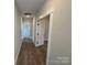 Long hallway with doors to bedrooms and bath at 5031 Mclaughlin Loop # 60, Waxhaw, NC 28173