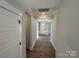 Light-filled hallway with hardwood floors and access to other rooms at 5031 Mclaughlin Loop # 60, Waxhaw, NC 28173