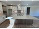 Large kitchen island with seating and a stylish black faucet at 5031 Mclaughlin Loop # 60, Waxhaw, NC 28173