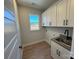 Laundry room with white cabinets and a utility sink at 5031 Mclaughlin Loop # 60, Waxhaw, NC 28173