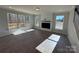 Bright living room featuring a fireplace and large windows with wooded views at 5031 Mclaughlin Loop # 60, Waxhaw, NC 28173