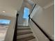 Modern staircase with light-filled window at 5031 Mclaughlin Loop # 60, Waxhaw, NC 28173