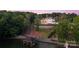 Majestic estate with lush landscaping, a private dock, and stunning water views, embodying luxurious waterfront living at 18304 Rosapenny Rd, Charlotte, NC 28278
