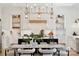 Bright dining room with stylish lighting, an inviting table, and a chef's kitchen with modern appliances at 18304 Rosapenny Rd, Charlotte, NC 28278