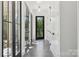 Hallway features sleek modern finishes and lots of natural light at 18304 Rosapenny Rd, Charlotte, NC 28278