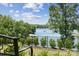 Enjoy a view of the lake from your beautifully landscaped backyard at 18304 Rosapenny Rd, Charlotte, NC 28278