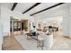 A bright and airy open-concept living space with hardwood floors and elegant decor throughout at 18304 Rosapenny Rd, Charlotte, NC 28278