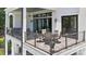 Enjoy the outdoor patio with ample seating, modern railing, and black-framed sliding glass doors for indoor/outdoor living at 18304 Rosapenny Rd, Charlotte, NC 28278