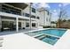 An inviting backyard pool with spa and steps, perfect for relaxation and recreation at 18304 Rosapenny Rd, Charlotte, NC 28278