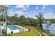 Beautiful pool area overlooking a lush landscape with lake views at 18304 Rosapenny Rd, Charlotte, NC 28278