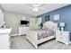 Spacious bedroom with a white bed frame and blue walls at 508 Cobbs Glen Ct, Rock Hill, SC 29732