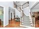 Grand two-story entrance with hardwood floors and a curved staircase at 508 Cobbs Glen Ct, Rock Hill, SC 29732