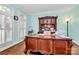 Home office with hardwood floors, built-in hutch, and plantation shutters at 508 Cobbs Glen Ct, Rock Hill, SC 29732