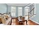 Living room with hardwood floors, neutral walls, and plantation shutters at 508 Cobbs Glen Ct, Rock Hill, SC 29732