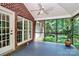 Bright screened porch with brick walls and wooded views at 508 Cobbs Glen Ct, Rock Hill, SC 29732