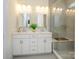 Modern bathroom with double vanity, large shower, and elegant tile at 1501 Striped Bass Ln, Lake Wylie, SC 29710