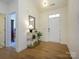 Bright entryway with hardwood floors and a decorative console table at 1501 Striped Bass Ln, Lake Wylie, SC 29710