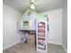 bedroom with custom playhouse bed and shelving at 3119 Hickory Hwy, Statesville, NC 28677