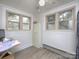 Bright bedroom with two windows and light-colored floors at 3119 Hickory Hwy, Statesville, NC 28677