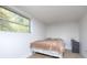 Bright bedroom with a comfortable bed, a nightstand, and a window at 3119 Hickory Hwy, Statesville, NC 28677