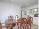 Elegant dining room featuring wooden table and chairs and natural light at 3119 Hickory Hwy, Statesville, NC 28677