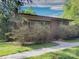 Charming brick home with a well-manicured lawn, mature trees, and a quaint walkway at 3119 Hickory Hwy, Statesville, NC 28677