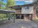 Two-story house featuring covered parking, upper patio, and a combination of brick and siding at 3119 Hickory Hwy, Statesville, NC 28677