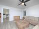 Living room featuring a gray sectional sofa and an entrance to the kitchen at 3119 Hickory Hwy, Statesville, NC 28677