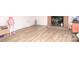 Spacious living room features new floors and a brick fireplace at 3119 Hickory Hwy, Statesville, NC 28677