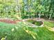 An elevated view of the landscaped backyard featuring terraced beds and a lush lawn at 859 Tamary Way # 34, Landis, NC 28088