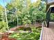 Beautiful backyard with terraced landscaping and mature trees creating a peaceful outdoor space at 859 Tamary Way # 34, Landis, NC 28088