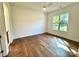 Sun-filled bedroom with hardwood floors and a large window, providing great natural light at 859 Tamary Way # 34, Landis, NC 28088
