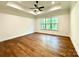 Bright, spacious bedroom with tray ceiling, ceiling fan, and a large window offering natural light at 859 Tamary Way # 34, Landis, NC 28088