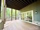 Spacious covered porch with wood flooring, a ceiling and natural light at 859 Tamary Way # 34, Landis, NC 28088