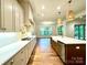 Bright kitchen with white cabinets, a large island, and a stainless steel farmhouse sink at 859 Tamary Way # 34, Landis, NC 28088