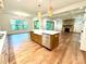 Bright kitchen with an island, stainless steel appliances, and beautiful hardwood floors at 859 Tamary Way # 34, Landis, NC 28088