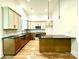 Modern kitchen featuring wood cabinets, stainless steel appliances, and pendant lighting at 859 Tamary Way # 34, Landis, NC 28088