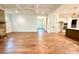 Bright living room featuring hardwood floors, stone fireplace, and open access to the kitchen at 859 Tamary Way # 34, Landis, NC 28088