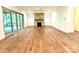 Spacious living room with a stone fireplace, hardwood floors, and access to the patio at 859 Tamary Way # 34, Landis, NC 28088