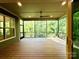 Inviting screened porch with wood floors, ceiling fan, and a view of the surrounding greenery at 859 Tamary Way # 34, Landis, NC 28088