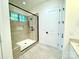 Contemporary walk-in shower with a glass door, a tile bench, and a tiled shower niche at 859 Tamary Way # 34, Landis, NC 28088
