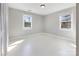 Bright bedroom with painted floors, natural light, and neutral color scheme, ready for personalization at 1628 Shannonhouse Dr, Charlotte, NC 28215