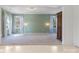 Spacious bonus room featuring neutral carpet, ample windows, and a decorative armoire at 1628 Shannonhouse Dr, Charlotte, NC 28215