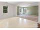 Open bonus room space with wood floors, carpeted sitting area, and plenty of natural light at 1628 Shannonhouse Dr, Charlotte, NC 28215