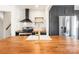 Close-up of kitchen island featuring wood countertop, white sink and modern faucet at 1628 Shannonhouse Dr, Charlotte, NC 28215