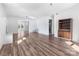 Spacious living room with wood floors, white walls, and an open layout at 1628 Shannonhouse Dr, Charlotte, NC 28215