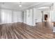 Open living space featuring hardwood floors, natural light, and neutral paint at 1628 Shannonhouse Dr, Charlotte, NC 28215